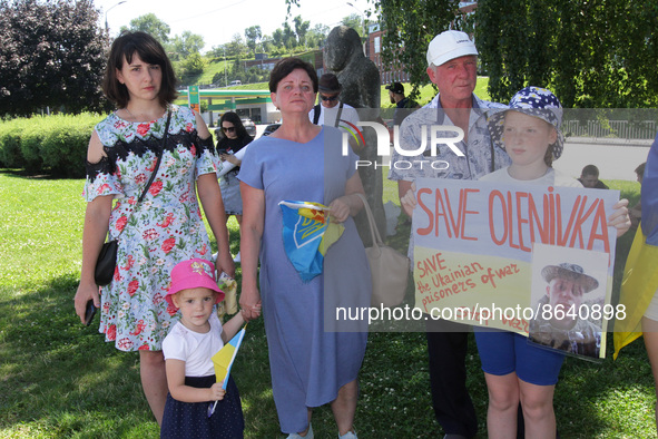 DNIPRO, UKRAINE - AUGUST 07, 2022 - People hold placards during the action in support of the Azovstal POWs at the Festival Pier to draw glob...