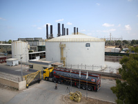 A fuel tanker arrives to unload at the 140-megawatt power plant in Nusseirat in the Gaza Strip, on August 8, 2022. - Fuel trucks entered Gaz...