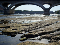 The riverbed of the Garonne river is seen under the 'Pont des Catalans' bridge in toulouse. Due to the drought, the Garonne river in Toulous...