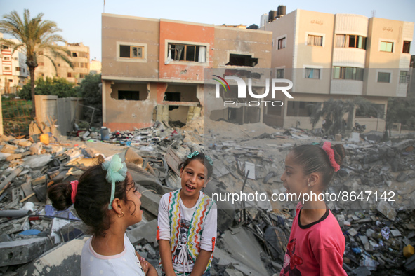 Palestinian children inspect their damaged building in Gaza city on August 9, 2022 after a ceasefire between Israel and Palestinian militant...