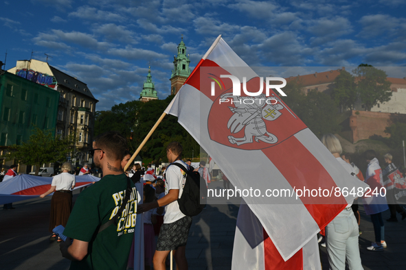 Members of the local Belarusian and Ukrainian diaspora supported by local Cracovians during the Solidarity with Belarus 2022 march, in the c...