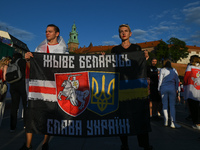 Protesters holding a banner with words 'Long Live Belarus and Glory To Ukraine'.Members of the local Belarusian and Ukrainian diaspora supp...