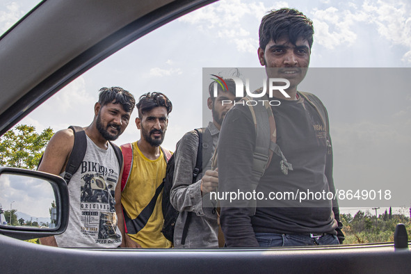 A group of young asylum seekers from Pakistan as seen walking on the road next to the cars near the city of Komotini next to Egnatia highway...