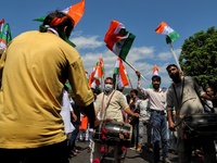 Party workers dance during the Tiranga Rally. BJP workers held Tri-Color (Tiranga) Rally in Baramulla Jammu and Kashmir India on 10 August 2...