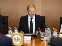 German Chancellor Olaf Scholz (C) before the weekly cabinet meeting at the Chancellery in Berlin, Germany on August 10, 2022. (