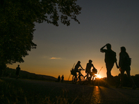 People enjoy sport activities at sunset, in Blonia Park in Krakow.
On Wednesday, August 10, 2022, in Krakow, Lesser Poland Voivodeship, Pola...