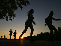 People enjoy sport activities at sunset, in Blonia Park in Krakow.
On Wednesday, August 10, 2022, in Krakow, Lesser Poland Voivodeship, Pola...