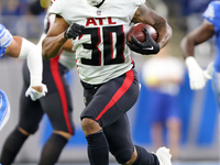 Atlanta Falcons running back Qadree Ollison (30) runs the ball during the first half of an NFL preseason football game against the Detroit L...