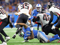 Atlanta Falcons cornerback Avery Williams (35) is tackled by Detroit Lions wide receiver Trinity Benson (17) during the first half of an NFL...