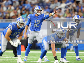 Detroit Lions quarterback Tim Boyle (12) gestures at the line before the snap during the first half of an NFL preseason football game agains...