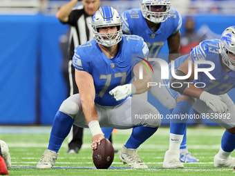 Center Frank Ragnow (77) of the Detroit Lions prepares to snap the ball during an NFL preseason football game between the Detroit Lions and...