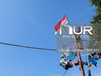 A child participated doing greased pole climbing competition during the 77th Indonesia Independence Day celebration, on 17 August 2022, in B...