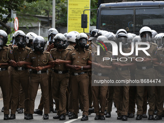 Sri Lankan police stands guard during the Inter-University Student Federation protest against the government of President Ranil Wickremesing...