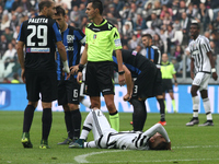 Juventus midfielder Roberto Pereyra (37) lies on the pitch injured during the Serie A football match n.9 JUVENTUS - ATALANTA on 25/10/15 at...