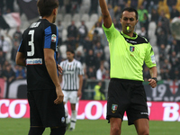 Atalanta defender Rafael Toloi (3) is shown a yellow card by the referee Marco Di Bello during the Serie A football match n.9 JUVENTUS - ATA...