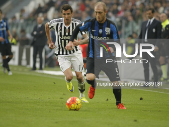 mario madzukic and andrea masiello during the serie A match between juventus fc and atalanta at the juventus stadium of turin on october 25,...