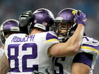 Minnesota Vikings tight end Kyle Rudolph (82) is congratulated by tackle Matt Kalil (75) after scoring a touchdown during the second quarter...