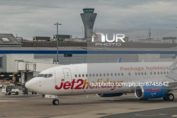 Jet2 Boeing 737-800 aircraft as seen in Edinburgh Airport in front of the terminal and the control tower. The Jet2.com Boeing 737 passenger...