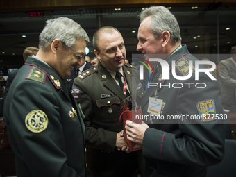 Ukrainian Major Gen Leonid Holopatiuk (L) , Latvian Major General Andis Dilāns  (C) and Viktor Muzhenko, Commander-in-Chief of the Armed For...