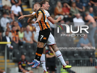 Hull City's Ozan Tufan contests a header with Sheffield United's Sander Berge during the Sky Bet Championship match between Hull City and Sh...