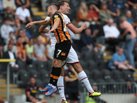 Hull City's Ozan Tufan contests a header with Sheffield United's Sander Berge during the Sky Bet Championship match between Hull City and Sh...