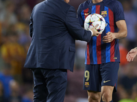 Robert Lewandowski centre-forward of Barcelona and Poland gets the match ball for scoring a hat trick during the UEFA Champions League group...