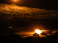Tanks fire projectiles during a Taiwanese military live-fire drill, after Beijing increased its military exercises near Taiwan, in Pingtung,...