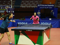 Dina Meshref (R) competes during the women's final match between Dina Meshref of Egypt and Yousra Helmy of Egypt at the ITTF Africa Senior C...