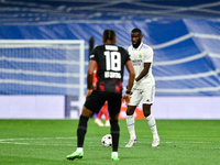 Antonio Rudiger and Christopher Nkunku during UEFA Champions League match between Real Madrid and RB Leipzig at Estadio Santiago Bernabeu on...