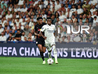 Vinicius Junior and Mohamed Simakan during UEFA Champions League match between Real Madrid and RB Leipzig at Estadio Santiago Bernabeu on Se...