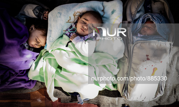 A child sleeps in Leros Refugee Camp, Greece, on October 30, 2015. Refugee camp Leros, located on the Greek Island of Leros is a transit cam...