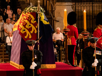 Members of the public pay their respects as they pass the coffin of Queen Elizabeth II, lying in state on the catafalque in Westminster Hall...