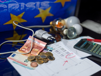 The price of electricity, electricity bill with money and light bulb. The European Union is preparing to take emergency action to reform its...
