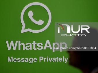 A silhouette of a woman is seen in front of a WhatsApp logo during Global Fintech Fest In Mumbai, India, 22 September, 2022.  (