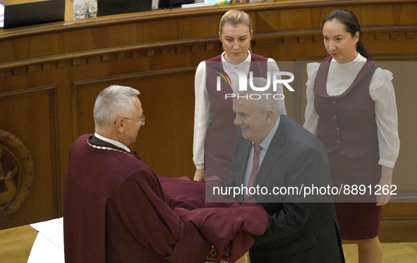 KYIV, UKRAINE - SEPTEMBER 21, 2022 - Acting Chief Justice of the Constitutional Court of Ukraine Serhiy Holovaty (L) hands over the robe to...