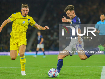 Kieran Tierney of Scotland National Team gets a cross in under pressure from Serhiy Sydorchuk of Ukraine during the UEFA Nations League matc...