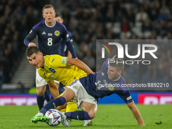 Ryan Christie of Scotland National Team tries to avoid the challenge from Ruslan Malinovskyi of Ukraine during the UEFA Nations League match...