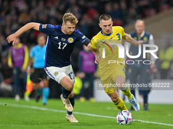 Ukraine's Bogdan Mykhaylichenko Scotland's Stuart Armstrong during the UEFA Nations League match between Scotland and Ukraine at Ham...
