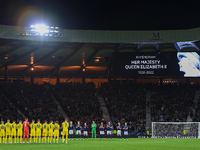 Both teams join a minute’s applause in memory of HM Queen Elizabeth during the UEFA Nations League match between Scotland and Ukraine at Ham...