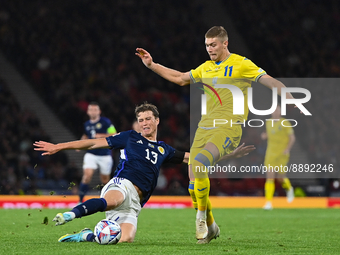Scotland's Jack Hendry tackles Ukraine's Artem Dovbyk during the UEFA Nations League match between Scotland and Ukraine at Hampden P...