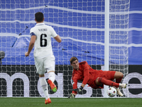 Thibaut Courtois goalkeeper of Real Madrid and Belgium makes a save during the UEFA Champions League group F match between Real Madrid and R...