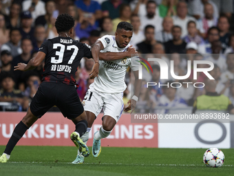 Rodrygo Goes right winger of Real Madrid and Brazil and Abdou Diallo centre-back of RB Leipzig and Senegal compete for the ball during the U...