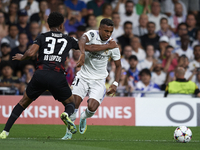 Rodrygo Goes right winger of Real Madrid and Brazil and Abdou Diallo centre-back of RB Leipzig and Senegal compete for the ball during the U...