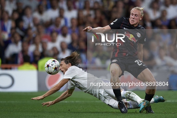 Xaver Schlager central midfield of RB Leipzig and Austria and Luka Modric central midfield of Real Madrid and Croatia compete for the ball d...