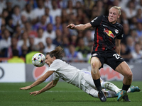 Xaver Schlager central midfield of RB Leipzig and Austria and Luka Modric central midfield of Real Madrid and Croatia compete for the ball d...