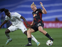 Xaver Schlager central midfield of RB Leipzig and Austria and Eduardo Camavinga central midfield of Real Madrid and France compete for the b...