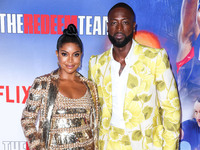 American actress Gabrielle Union wearing Valentino and husband/American former professional basketball player Dwyane Wade wearing Gucci arri...