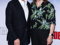 American film producer and director Frank Marshall and wife/American film producer and President of Lucasfilm Kathleen Kennedy arrive at the...