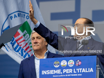Silvio Berlusconi, leader of Forza Italia, greets his supporters at the end of his speech during the political meeting organised by the righ...