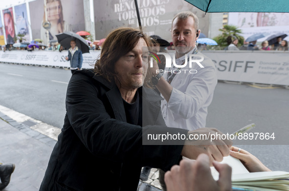 Actor Norman Reedus signs autographs upon his arrival at the San Sebastian Film Festival, at the Hotel Maria Cristina, on September 23, 2022...